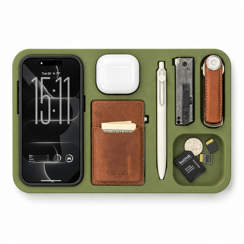 The Kept EDC Tray in olive green, holding a phone, earbuds case, wallet, pen, knife, key organizer and small items