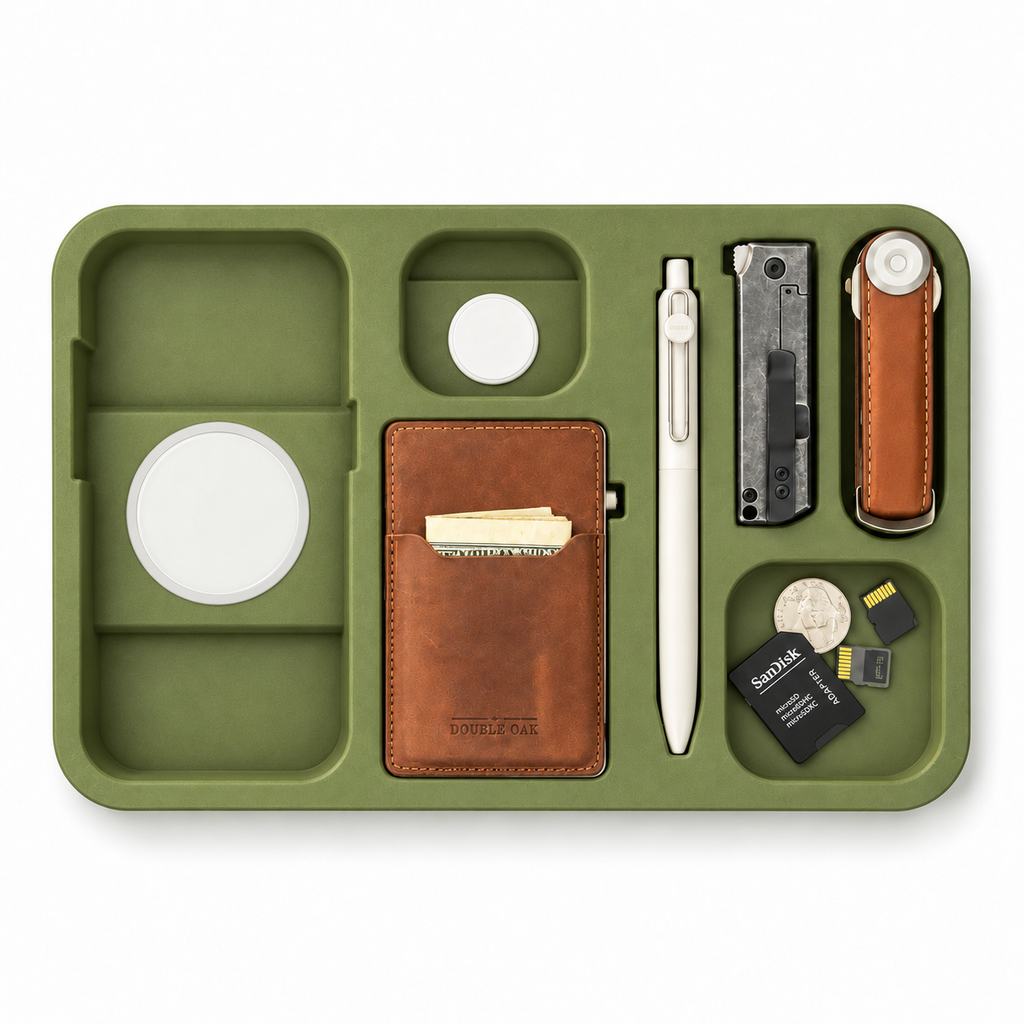 The Kept EDC Tray with the phone and earbuds removed, showing the built-in charging pads
